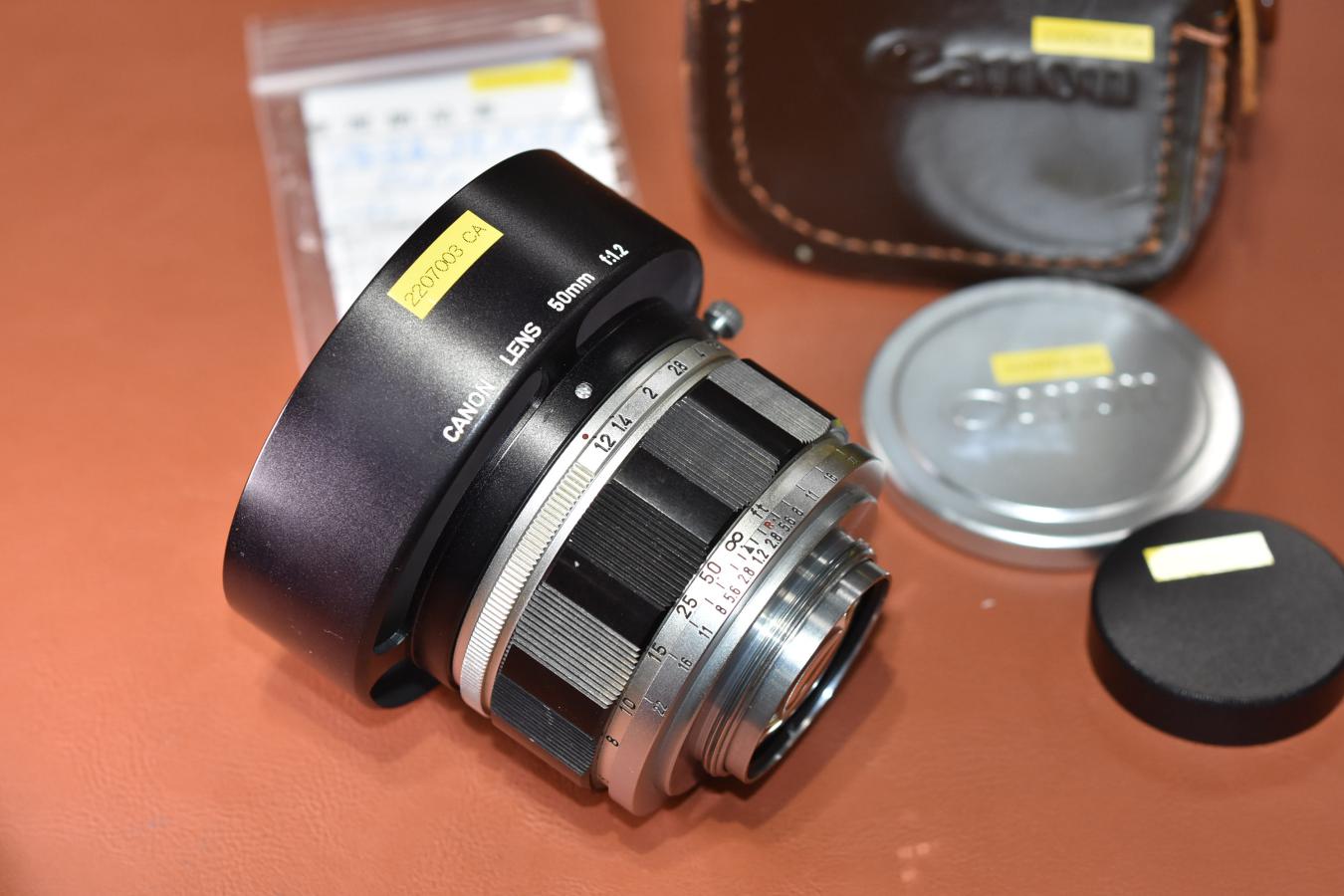 Canon 50mm F1.2 整備済 純正メタルフード、55mm銀枠フィルター付